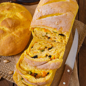 Fresh homemade pumpkin bread and pumpkin slices and olives