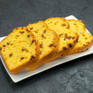 front-view-delicious-sliced-cake-inside-plate-dark-surface-sweet-cake-biscuit-tea-pie-tea