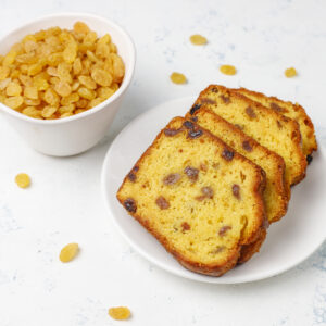 Traditional raisin cake slices with raisin on light background,top view